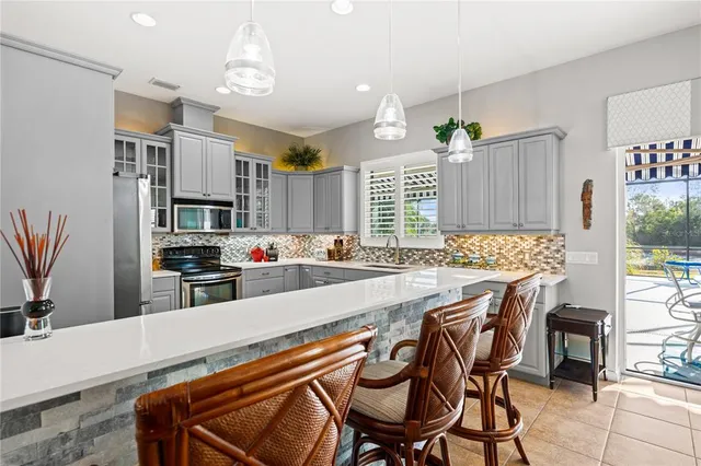 a large kitchen with lots of counter space and appliances