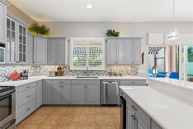 a kitchen with a sink stove and cabinets
