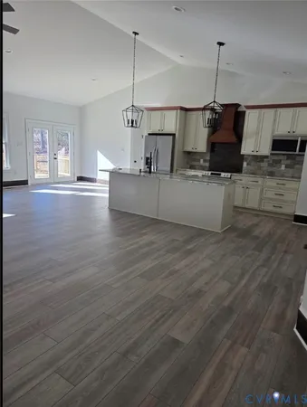 a view of a living room a room and wooden floor