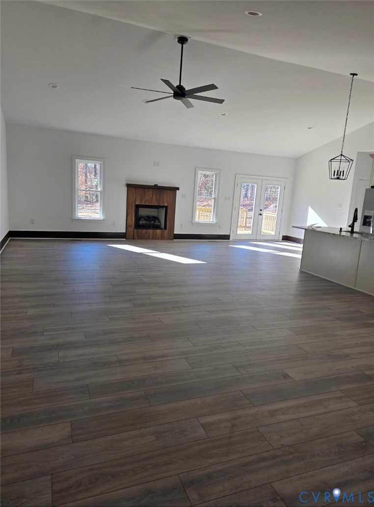 632 Signboard Road Bumpass, VA 23024 - Photo 4 of 6 a view of a livingroom with hardwood floor and a ceiling fan