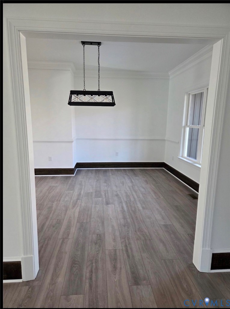 632 Signboard Road Bumpass, VA 23024 - Photo 6 of 6 a view of a room with wooden floor and white walls