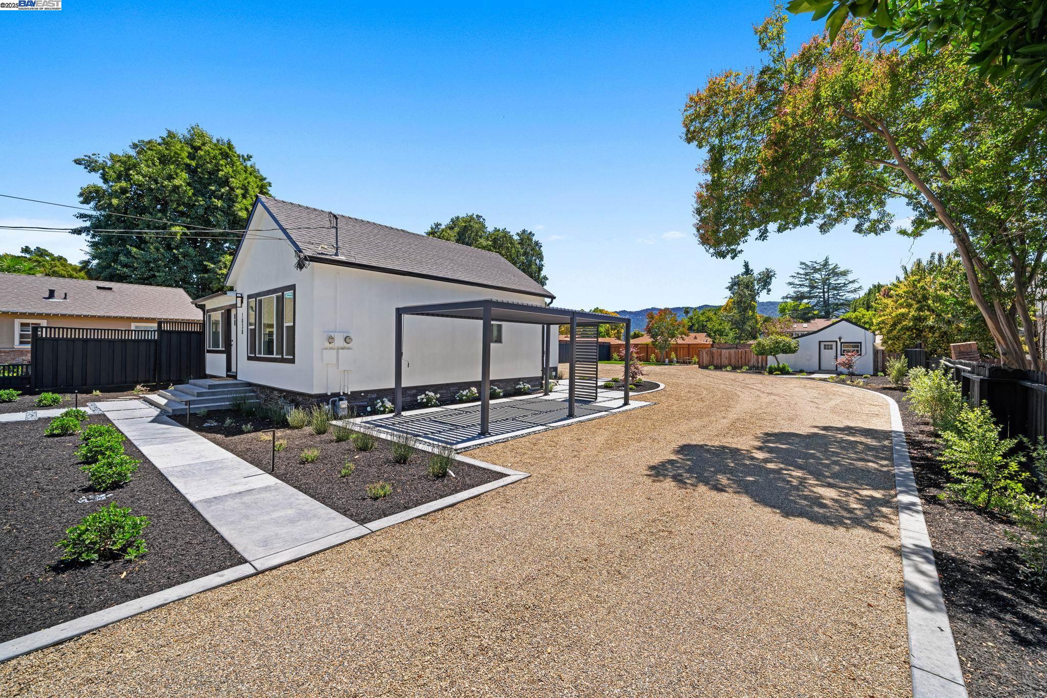 1038 Division Street Pleasanton, CA 94566 - Photo 12 of 53 a view of a house with backyard and a tree