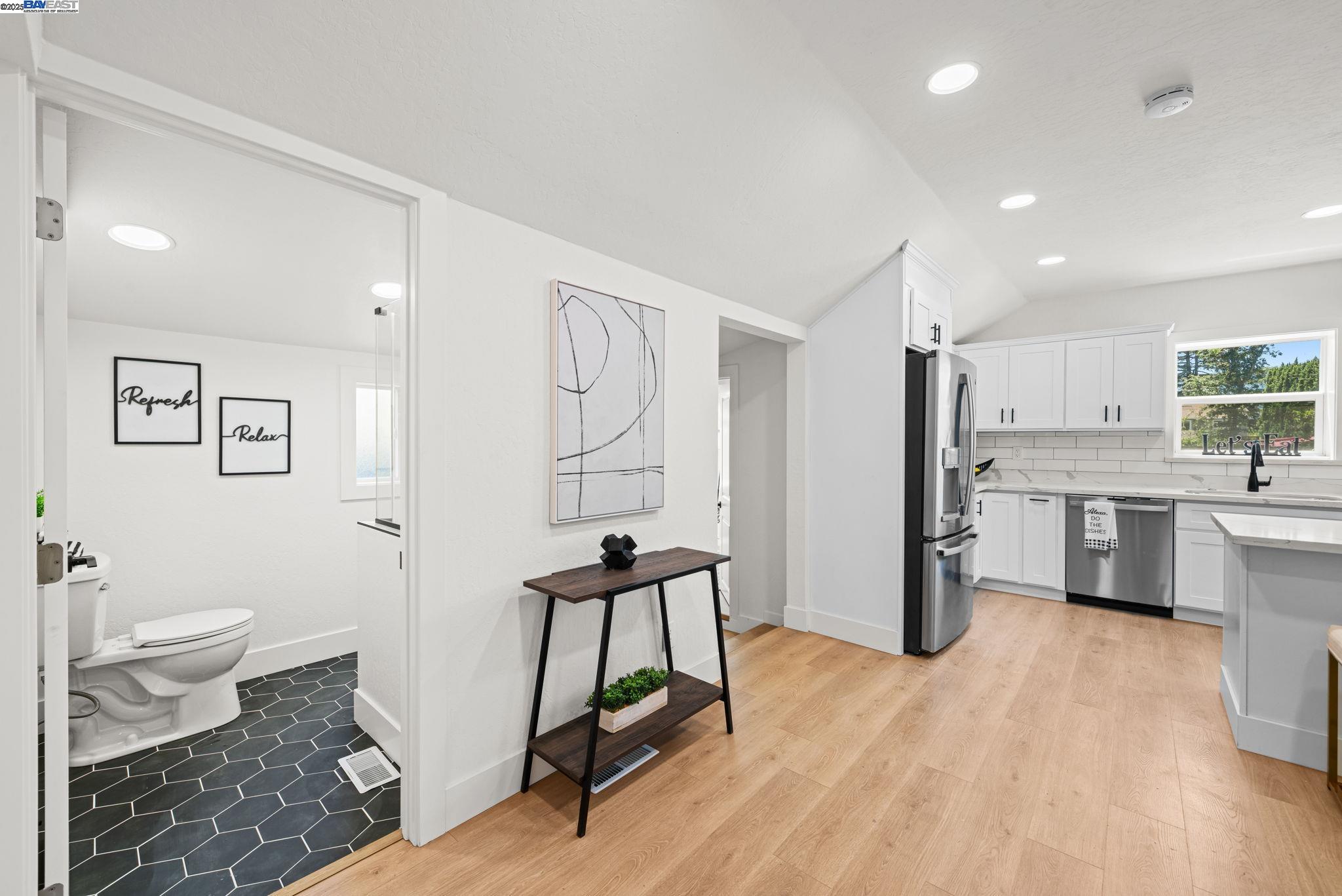 1038 Division Street Pleasanton, CA 94566 - Photo 26 of 53 a open kitchen with white cabinets and stainless steel appliances