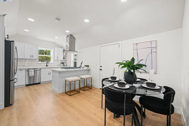 a kitchen with stainless steel appliances a refrigerator stove and sink