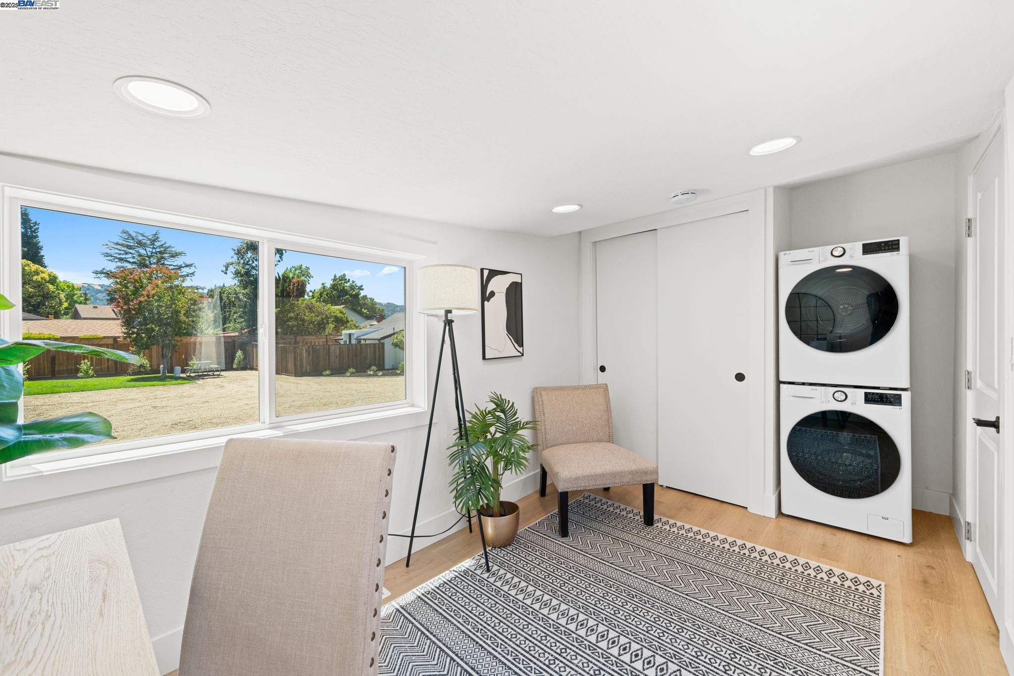 1038 Division Street Pleasanton, CA 94566 - Photo 35 of 53 a living room with furniture a rug and a floor to ceiling window