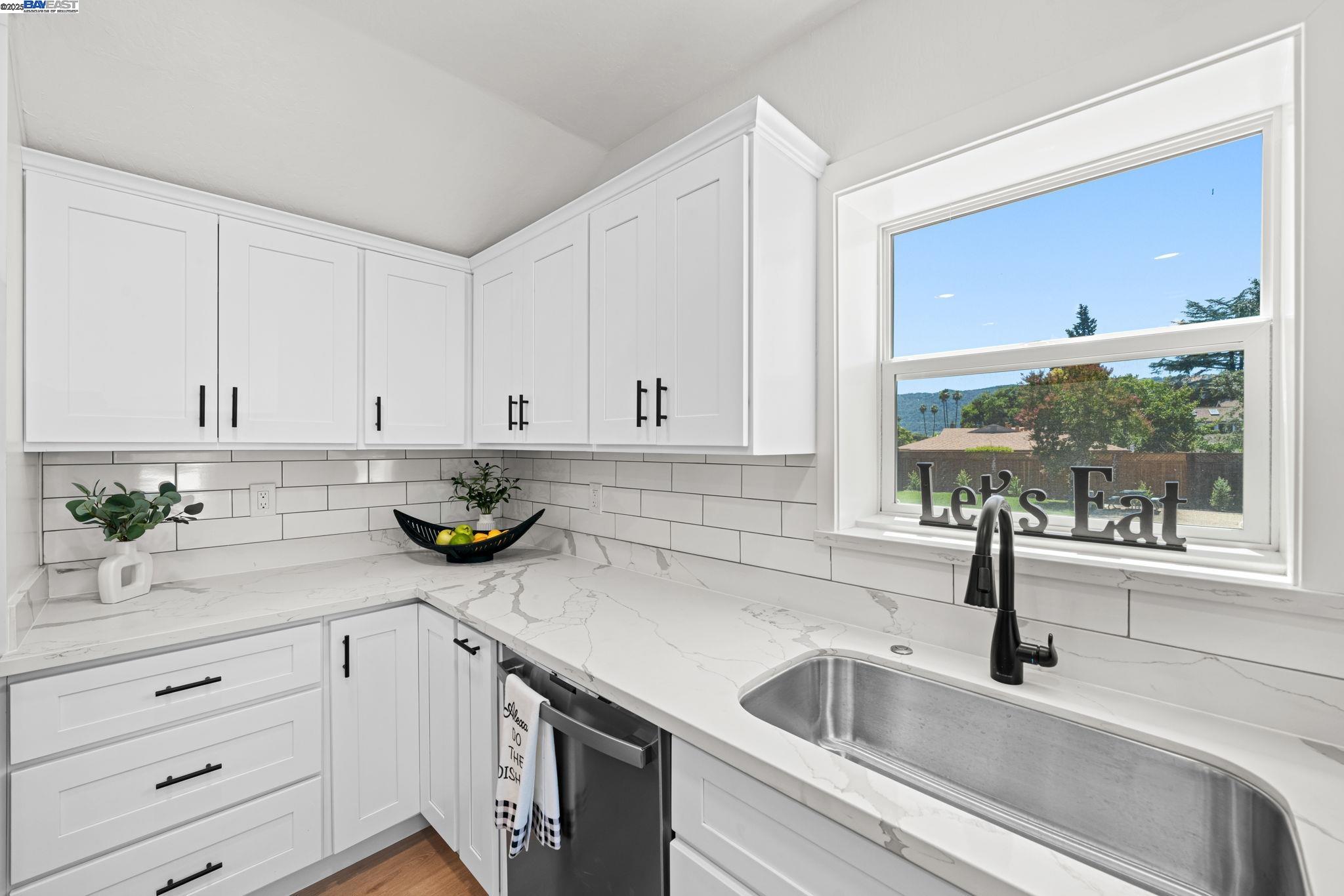 1038 Division Street Pleasanton, CA 94566 - Photo 39 of 53 a kitchen with a sink and cabinets
