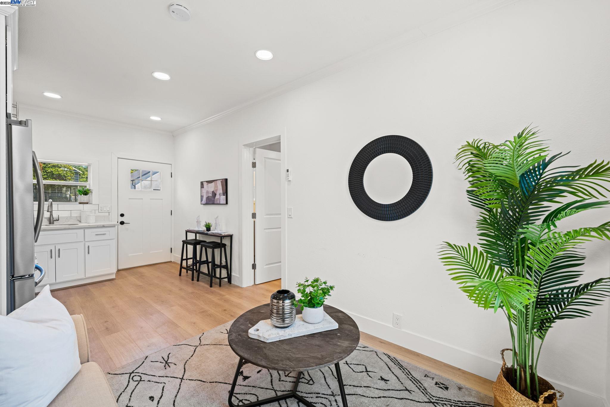 1038 Division Street Pleasanton, CA 94566 - Photo 40 of 53 a living room with furniture potted plant and a mirror