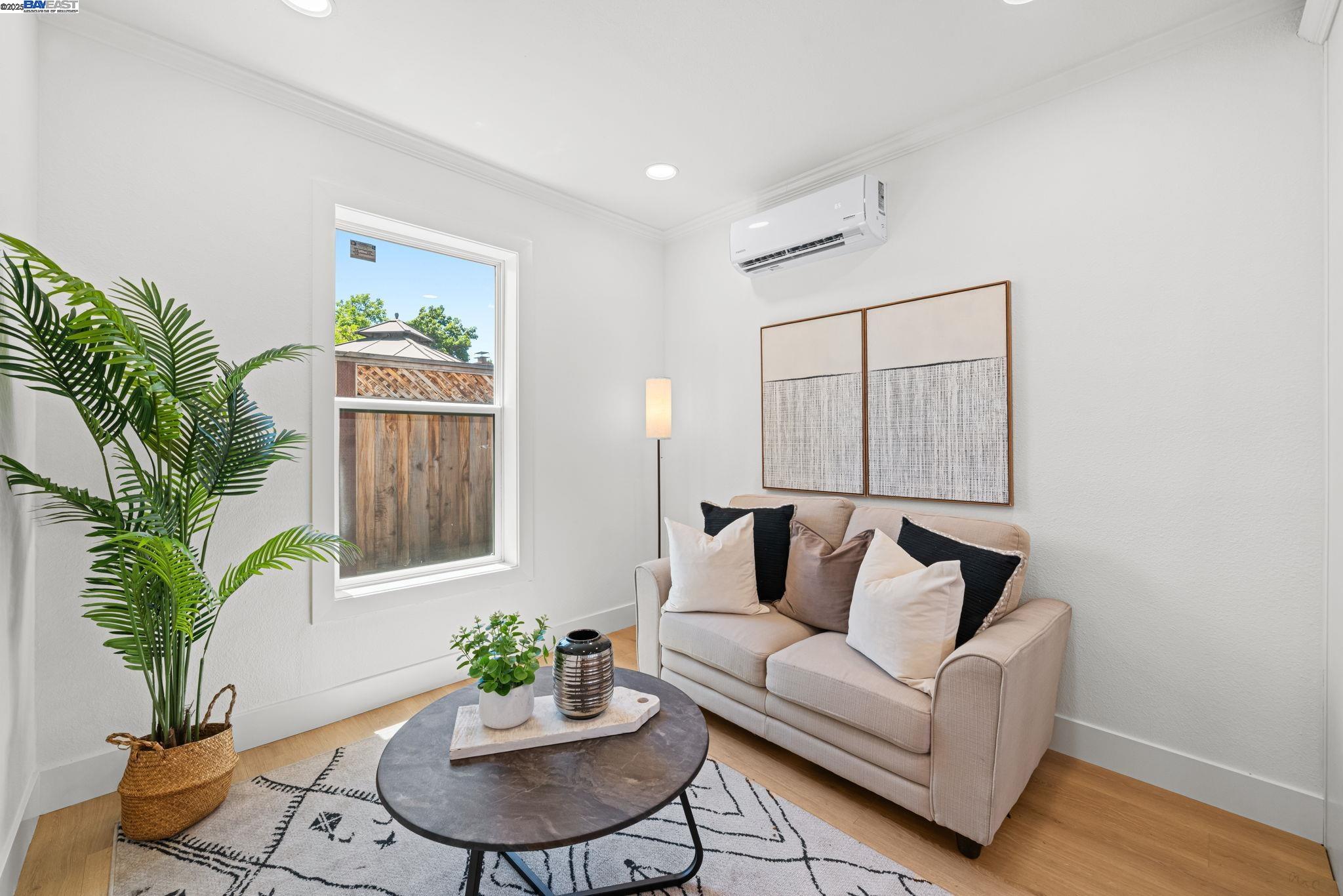 1038 Division Street Pleasanton, CA 94566 - Photo 41 of 53 a living room with furniture potted plant and a window