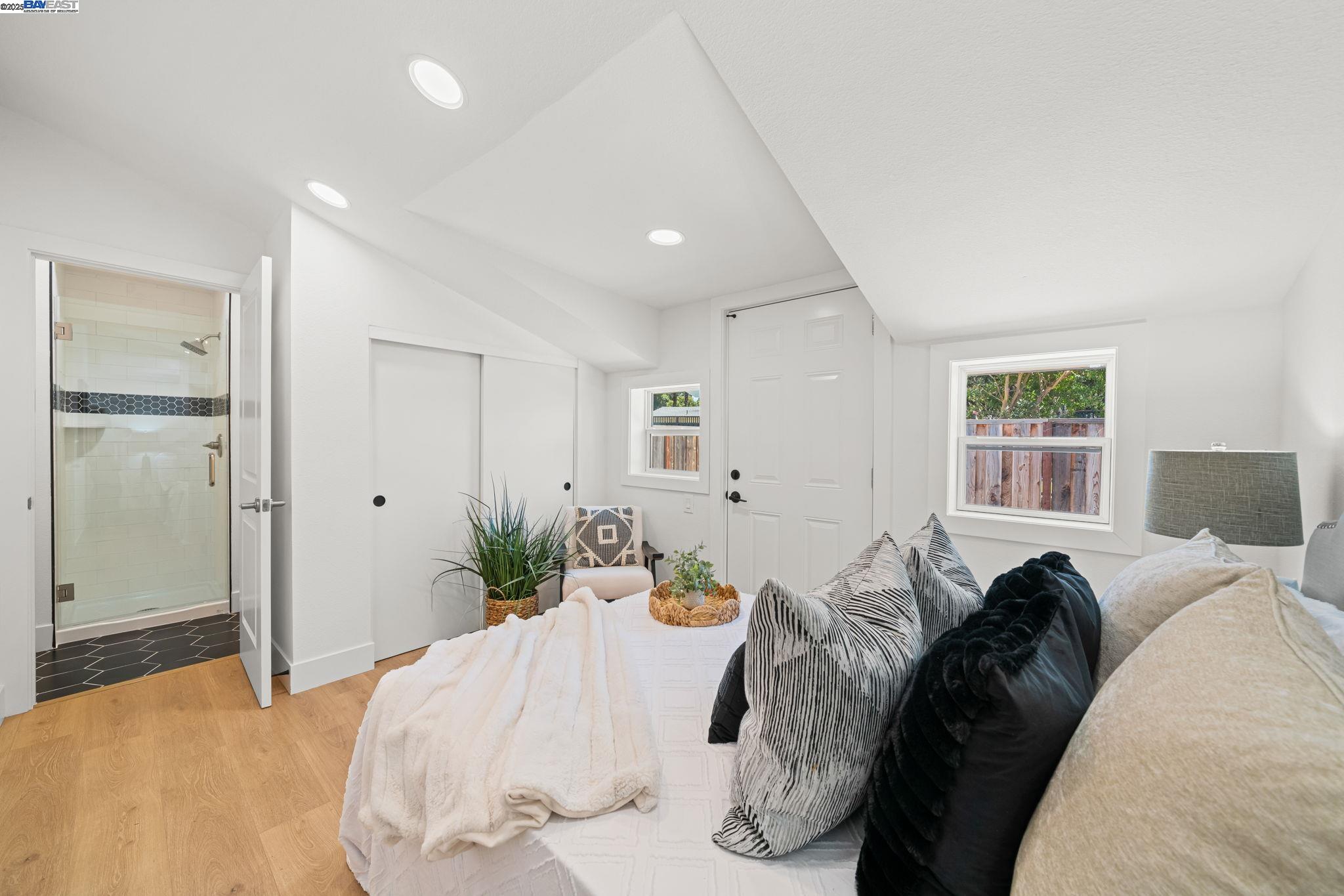 1038 Division Street Pleasanton, CA 94566 - Photo 44 of 53 a bed room with a bed and a large mirror