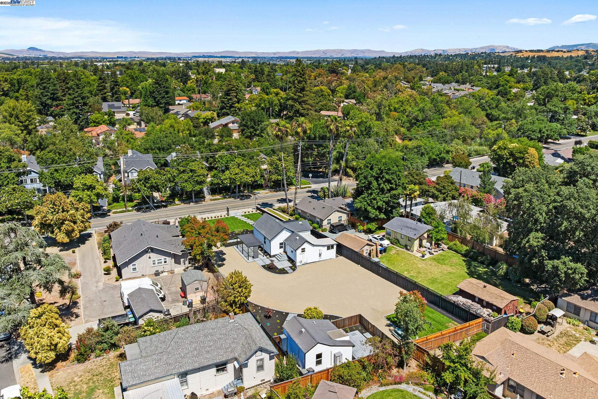 1038 Division Street Pleasanton, CA 94566 - Photo 6 of 53 an aerial view of residential houses with outdoor space