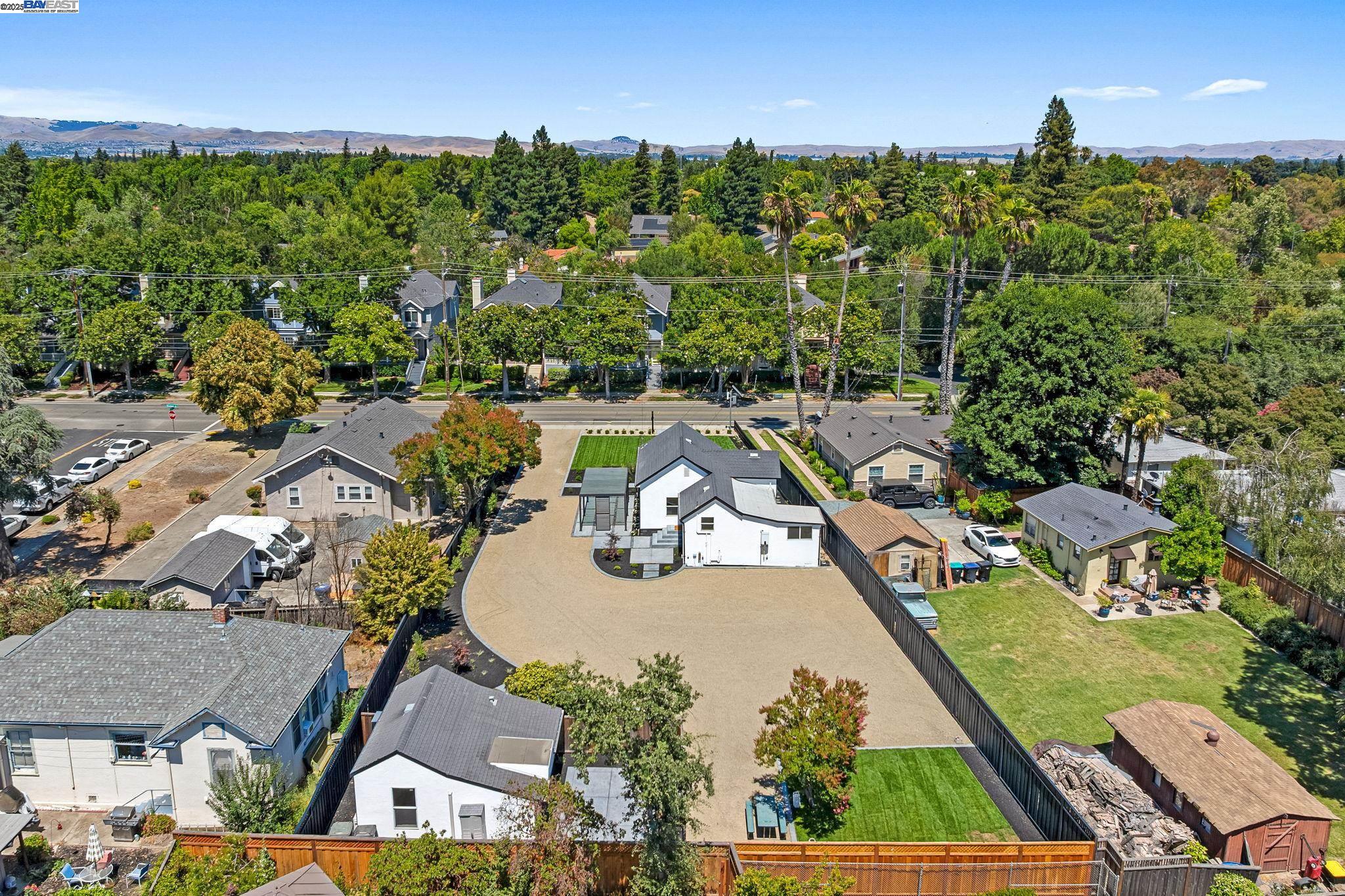 1038 Division Street Pleasanton, CA 94566 - Photo 7 of 53 an aerial view of a house with garden space and outdoor seating