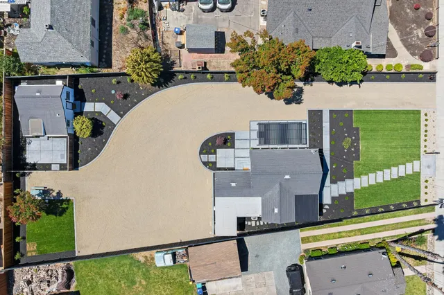 an aerial view of a house with a swimming pool