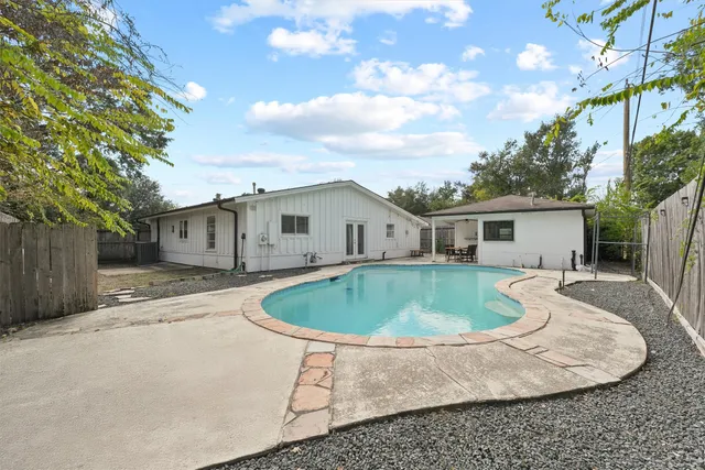 a house view with a backyard space