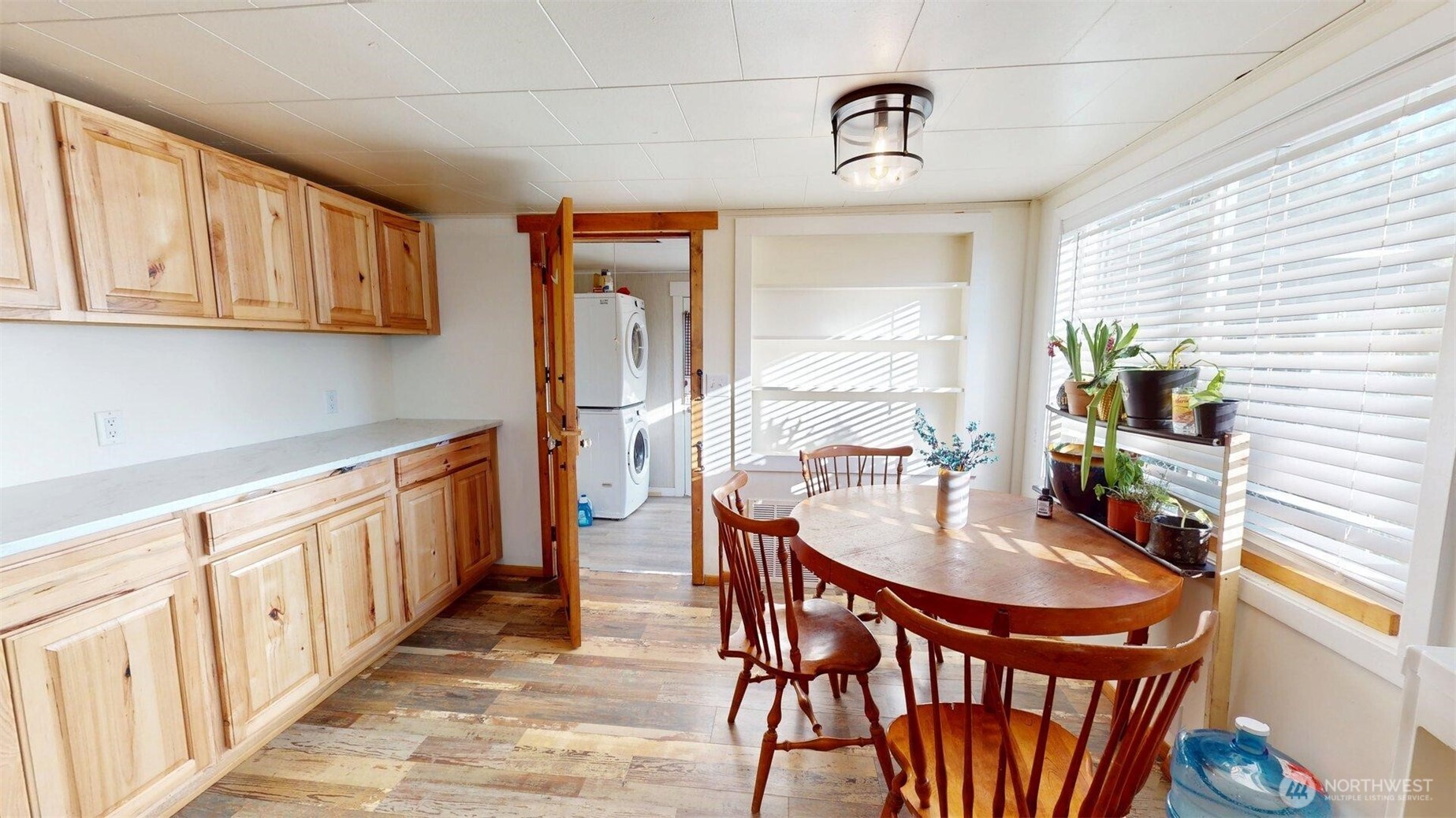2124 Woburn Street Bellingham, WA 98229 - Photo 17 of 40 a kitchen with stainless steel appliances a table and chairs