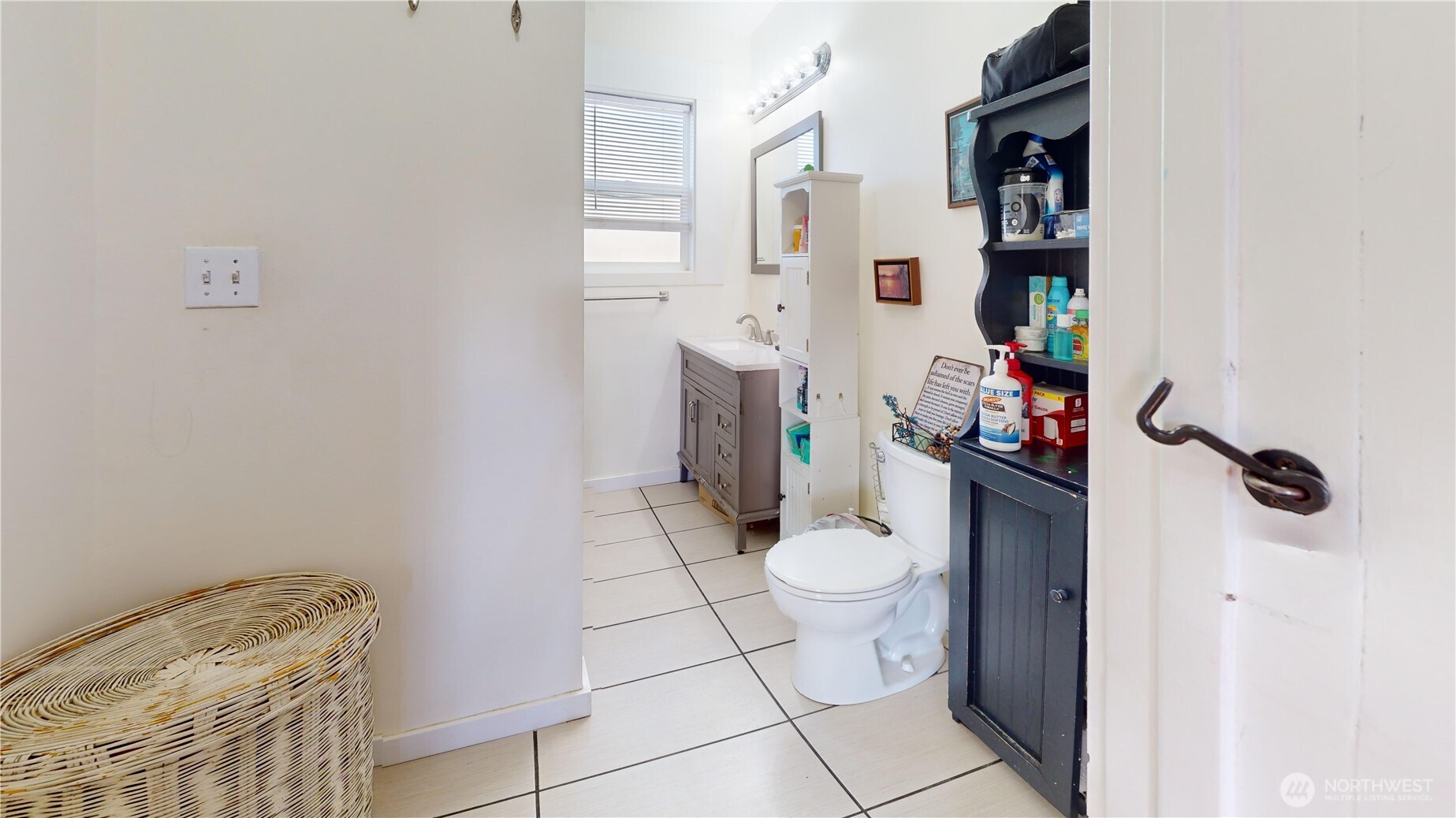2124 Woburn Street Bellingham, WA 98229 - Photo 19 of 40 a bathroom with a toilet and a shower curtain