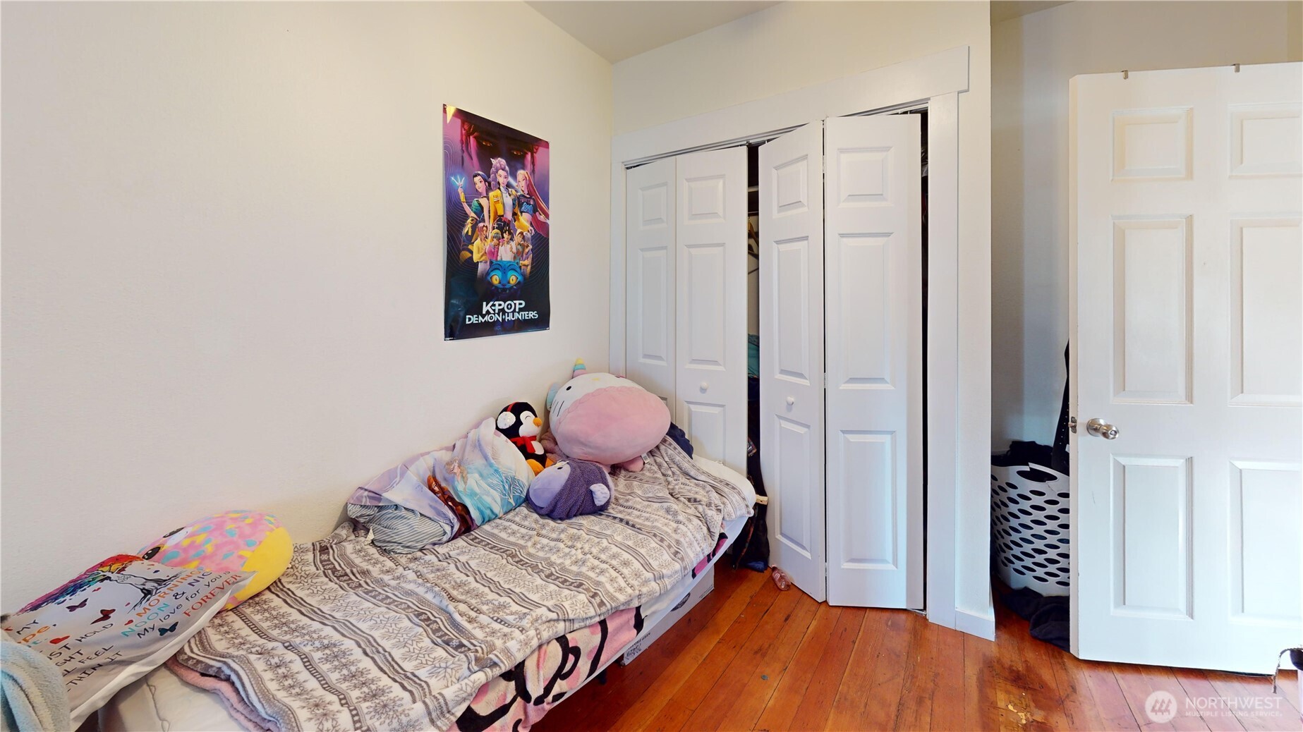 2124 Woburn Street Bellingham, WA 98229 - Photo 21 of 40 a bedroom with a bed and wooden floor
