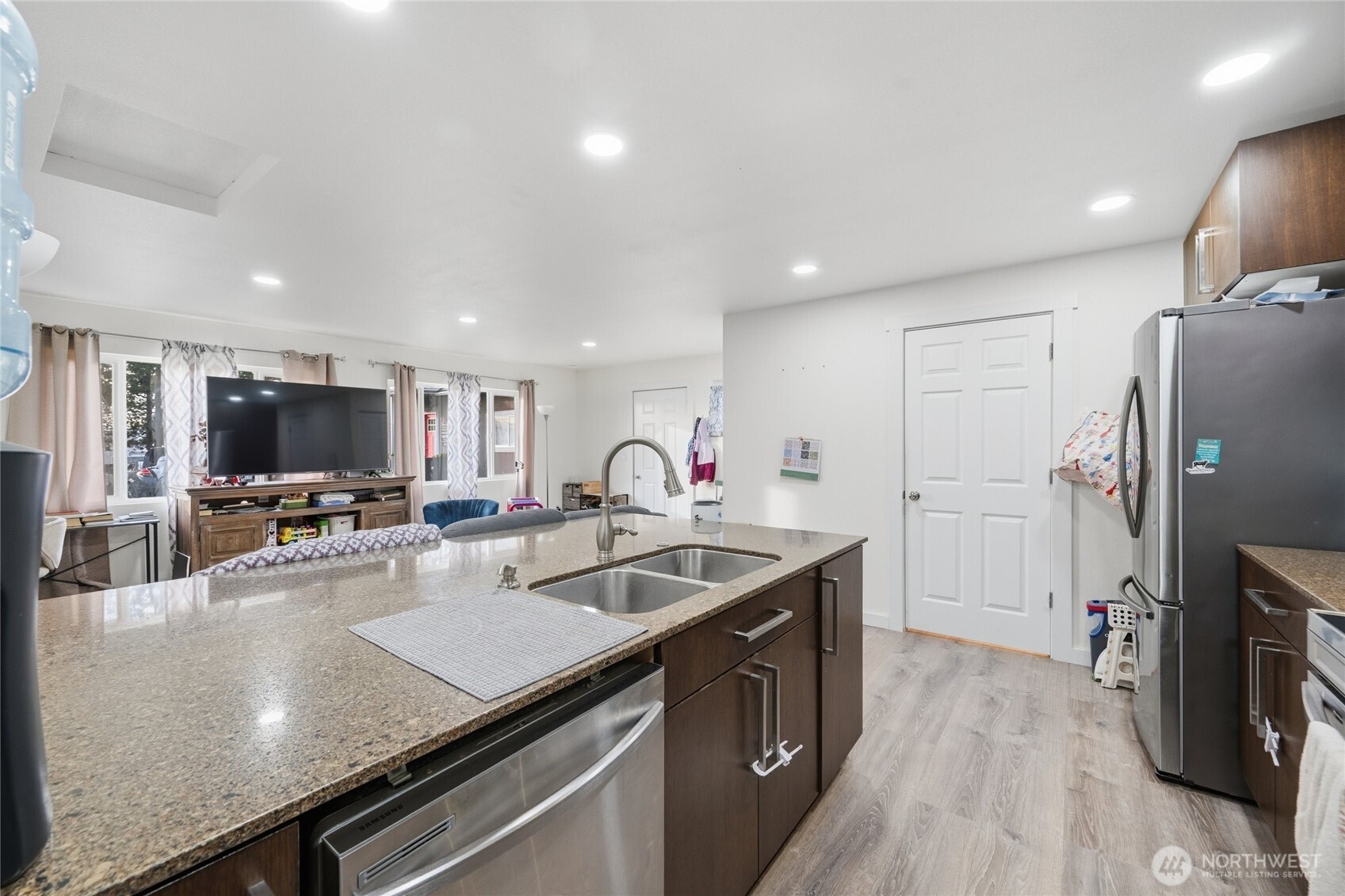 2124 Woburn Street Bellingham, WA 98229 - Photo 32 of 40 a kitchen with stainless steel appliances granite countertop a sink a stove and a refrigerator
