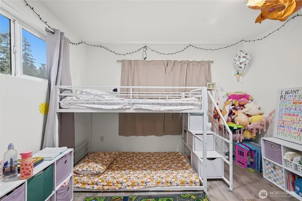 a bed room with a bed and a window