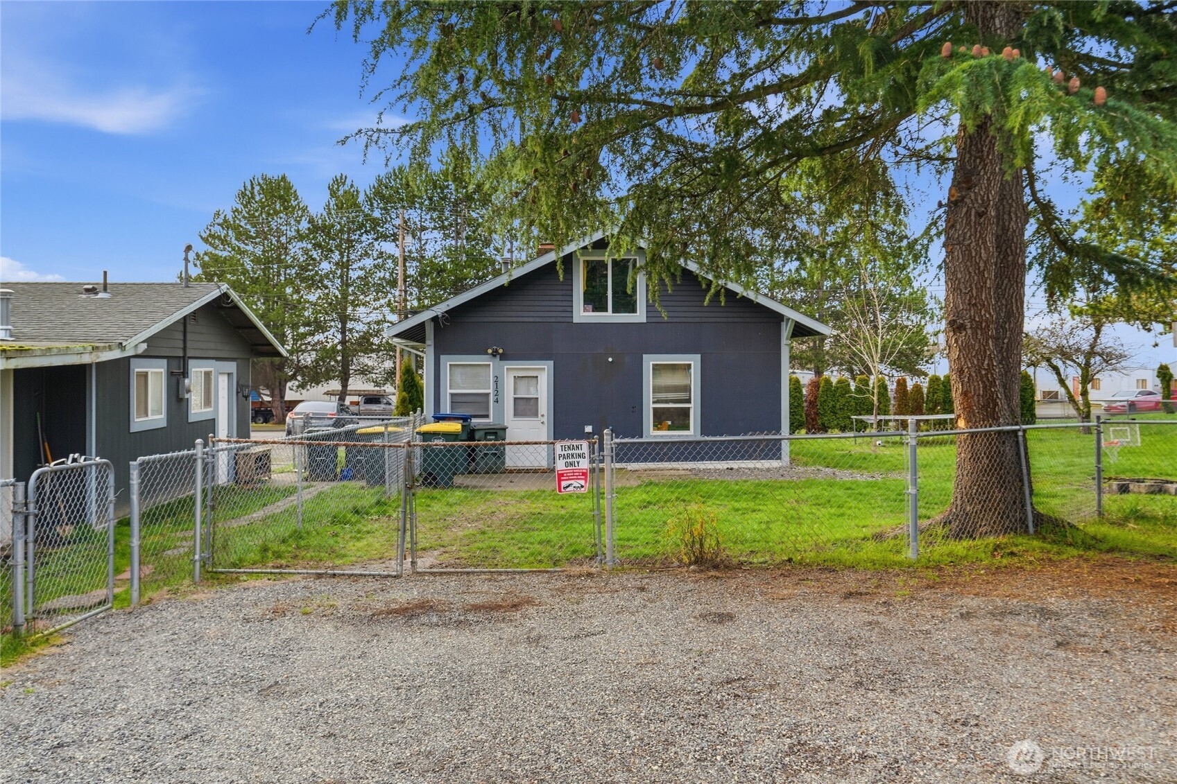 2124 Woburn Street Bellingham, WA 98229 - Photo 38 of 40 a front view of a house with a yard and garage