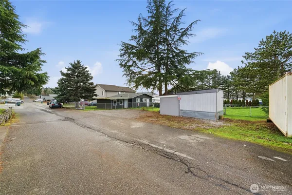 a front view of a house with a yard and a garage
