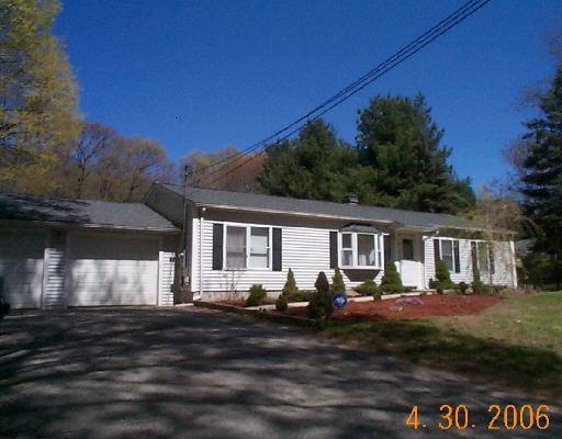 5 Walker Hill Road Newtown, CT 06482 - Photo 1 of 1 a front view of a house with garden