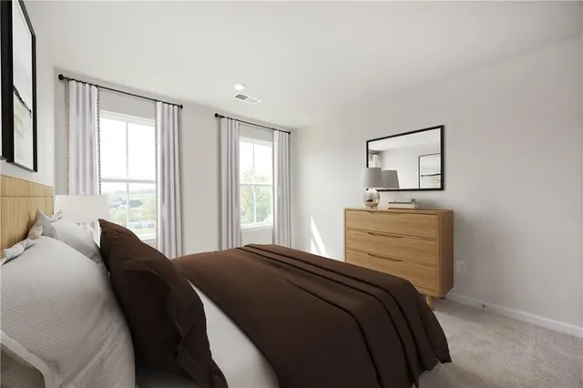 a bedroom with a bed and a dresser