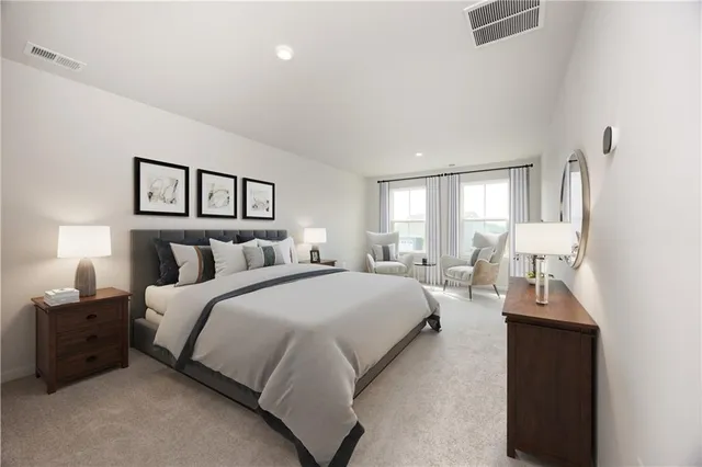 a spacious bedroom with a bed and a window