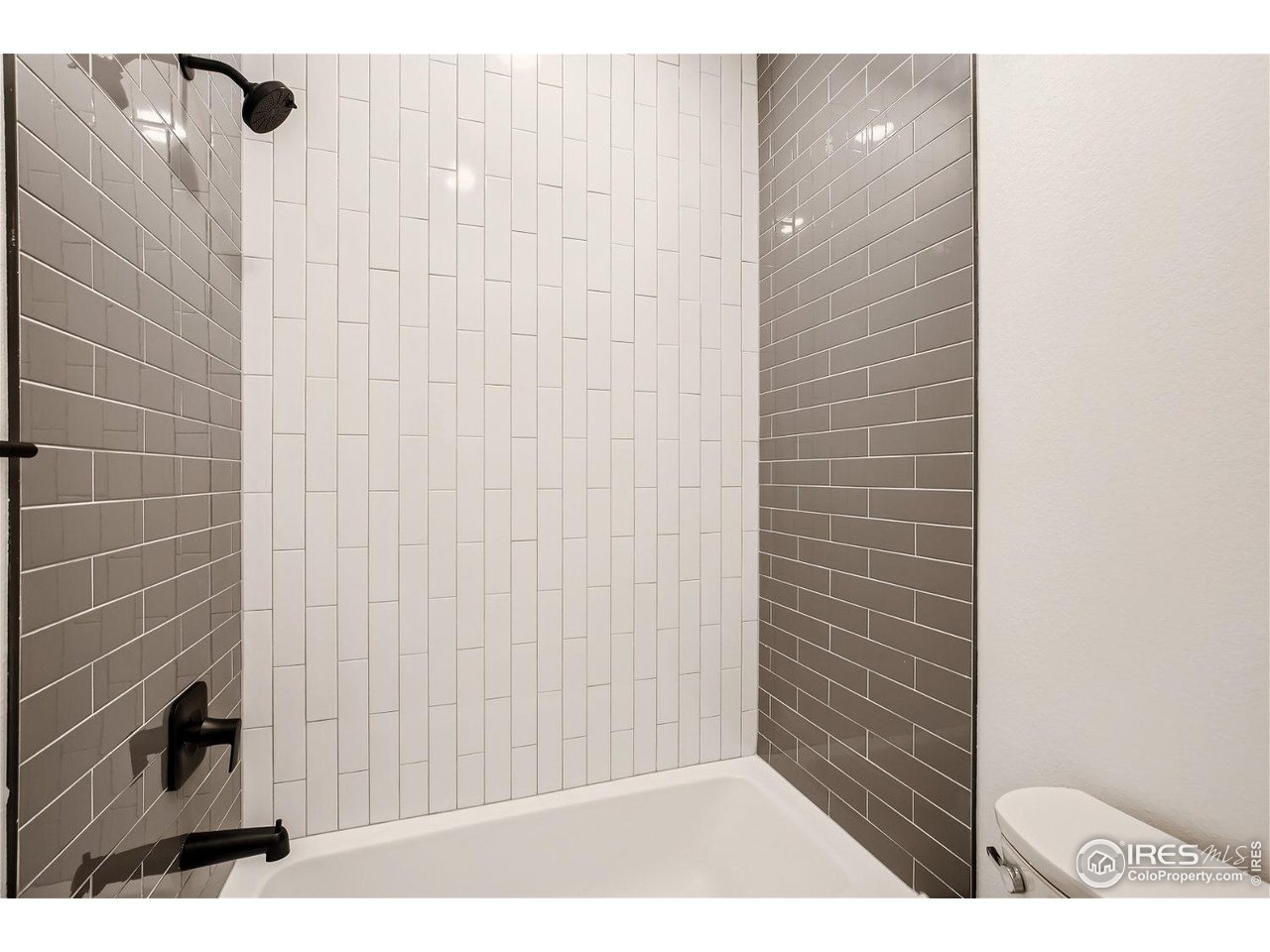 335 Boxwood Drive Windsor, CO 80550 - Photo 13 of 23 a bathroom with a shower and a sink