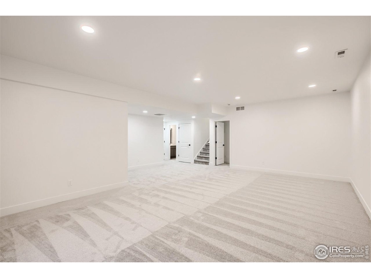 335 Boxwood Drive Windsor, CO 80550 - Photo 15 of 23 a view of empty room with wooden floor
