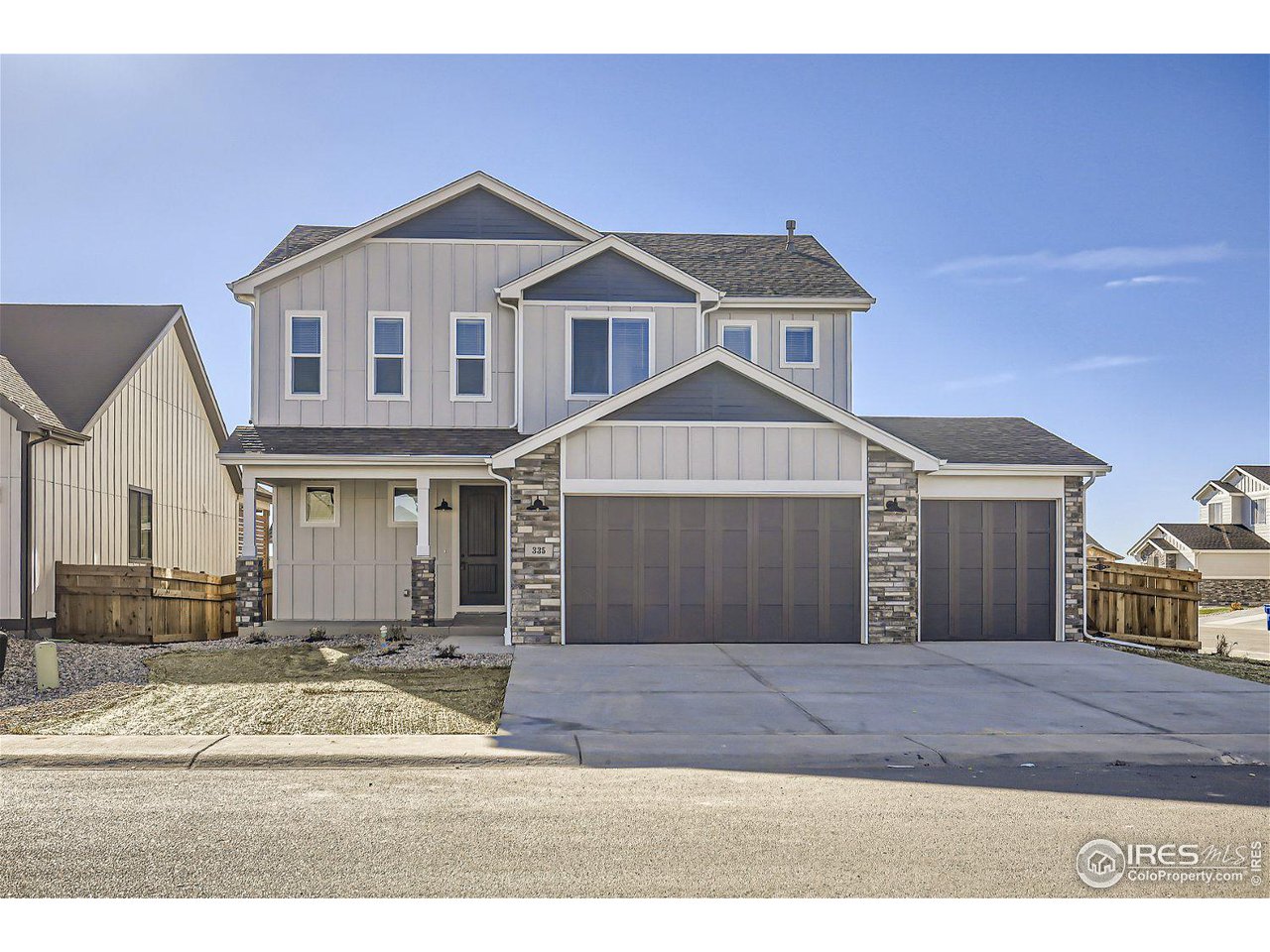 335 Boxwood Drive Windsor, CO 80550 - Photo 2 of 23 a front view of a house with a yard