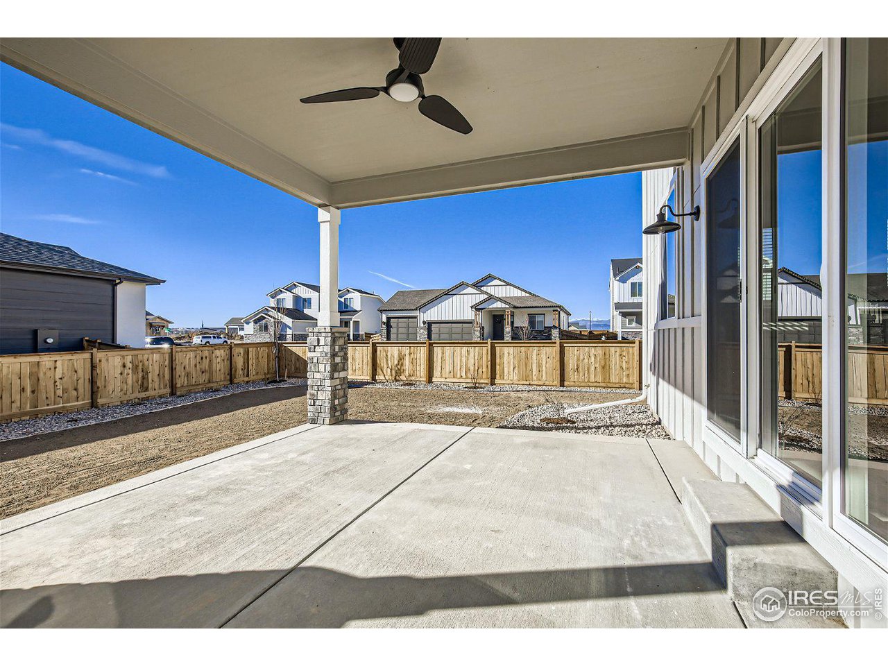 335 Boxwood Drive Windsor, CO 80550 - Photo 21 of 23 a view of a hall with wooden floor