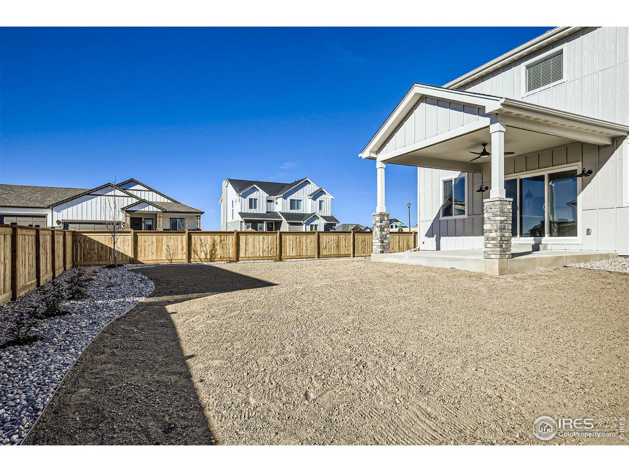 335 Boxwood Drive Windsor, CO 80550 - Photo 22 of 23 a view of a house with backyard porch and sitting area