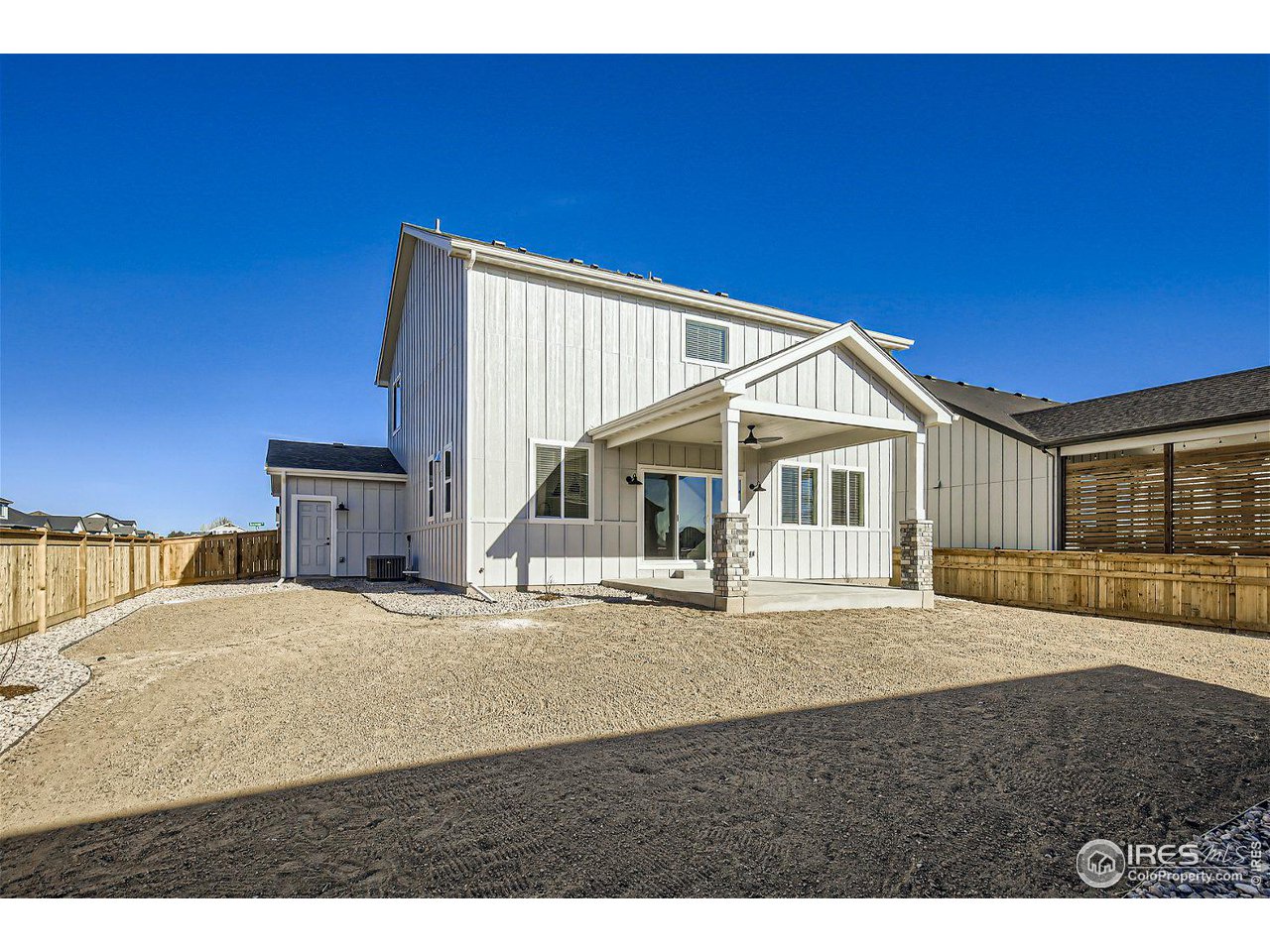 335 Boxwood Drive Windsor, CO 80550 - Photo 23 of 23 a view of a house with backyard and porch