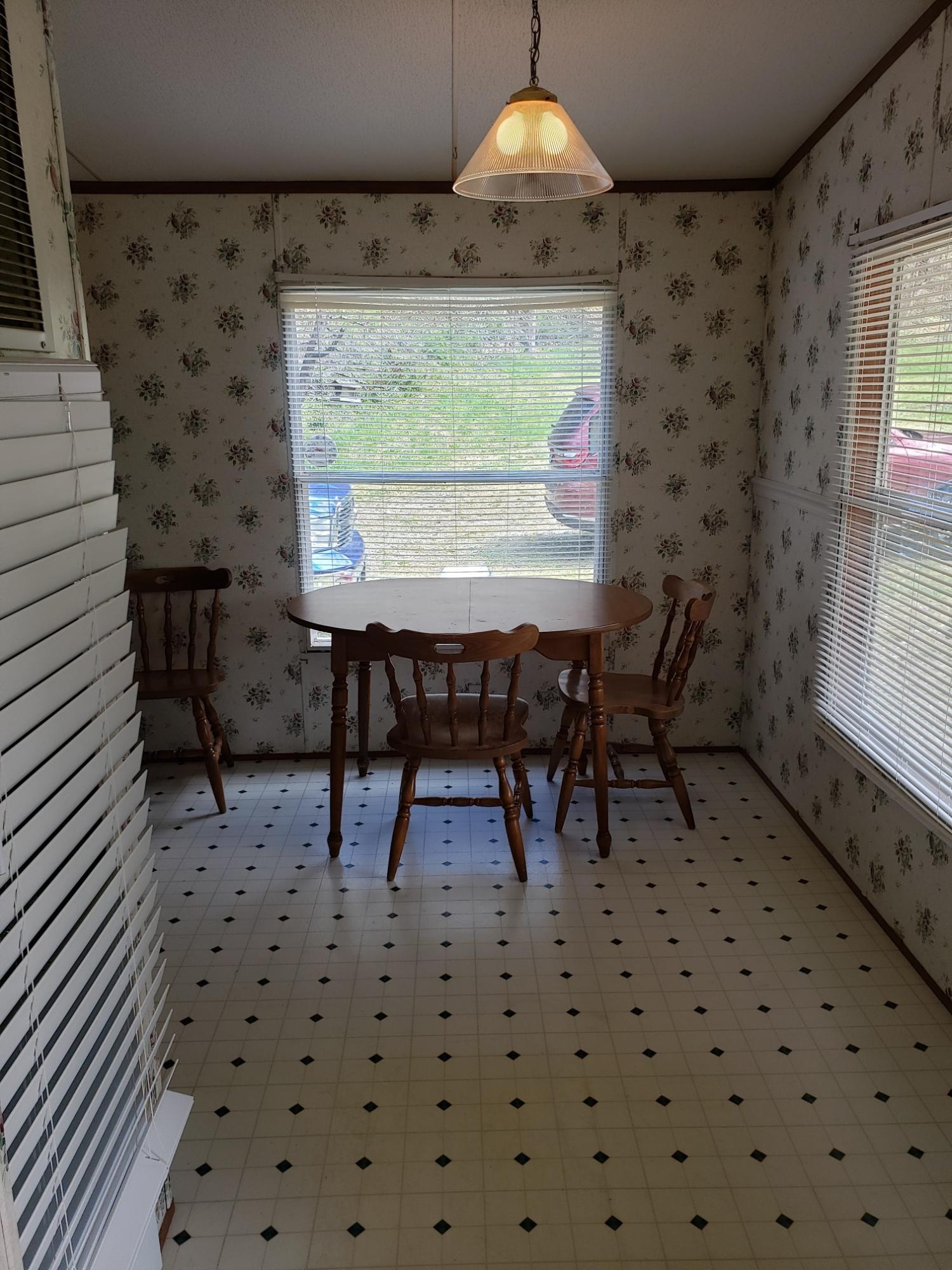 2900 Alleghany Spring Road Shawsville, VA 24162 - Photo 17 of 19 a dining room with a table and chairs
