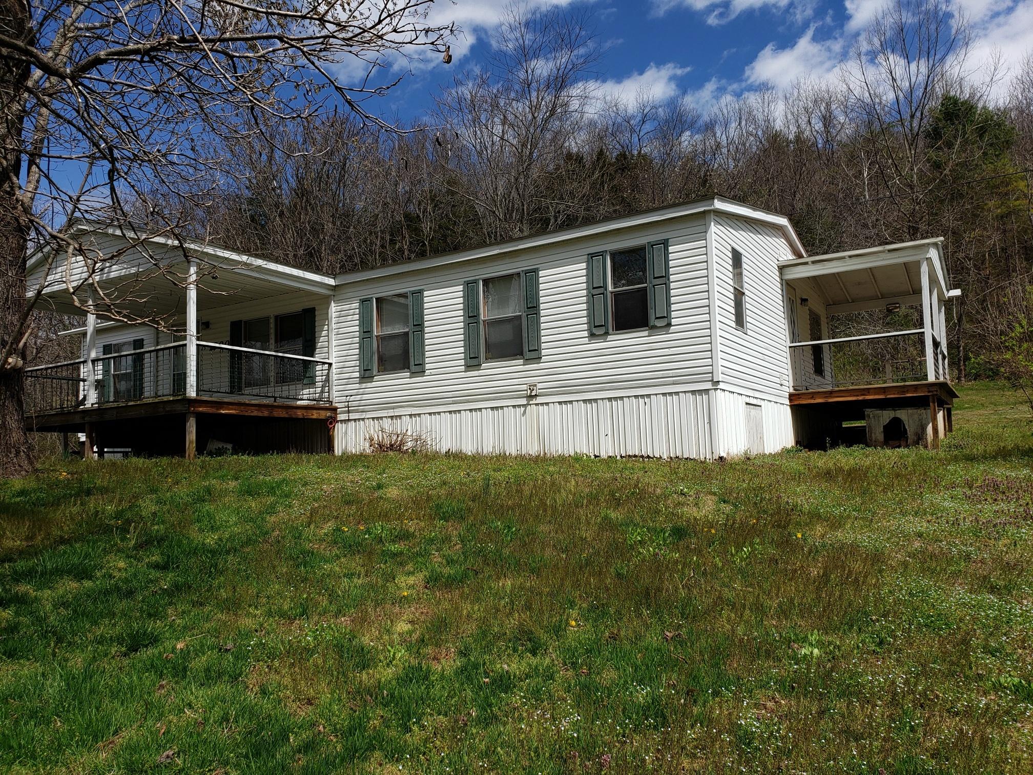 2900 Alleghany Spring Road Shawsville, VA 24162 - Photo 18 of 19 a view of a house with a yard