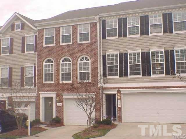 5306 Echo Ridge Road Raleigh, NC 27612 - Photo 1 of 3 a front view of a house with a lot of windows