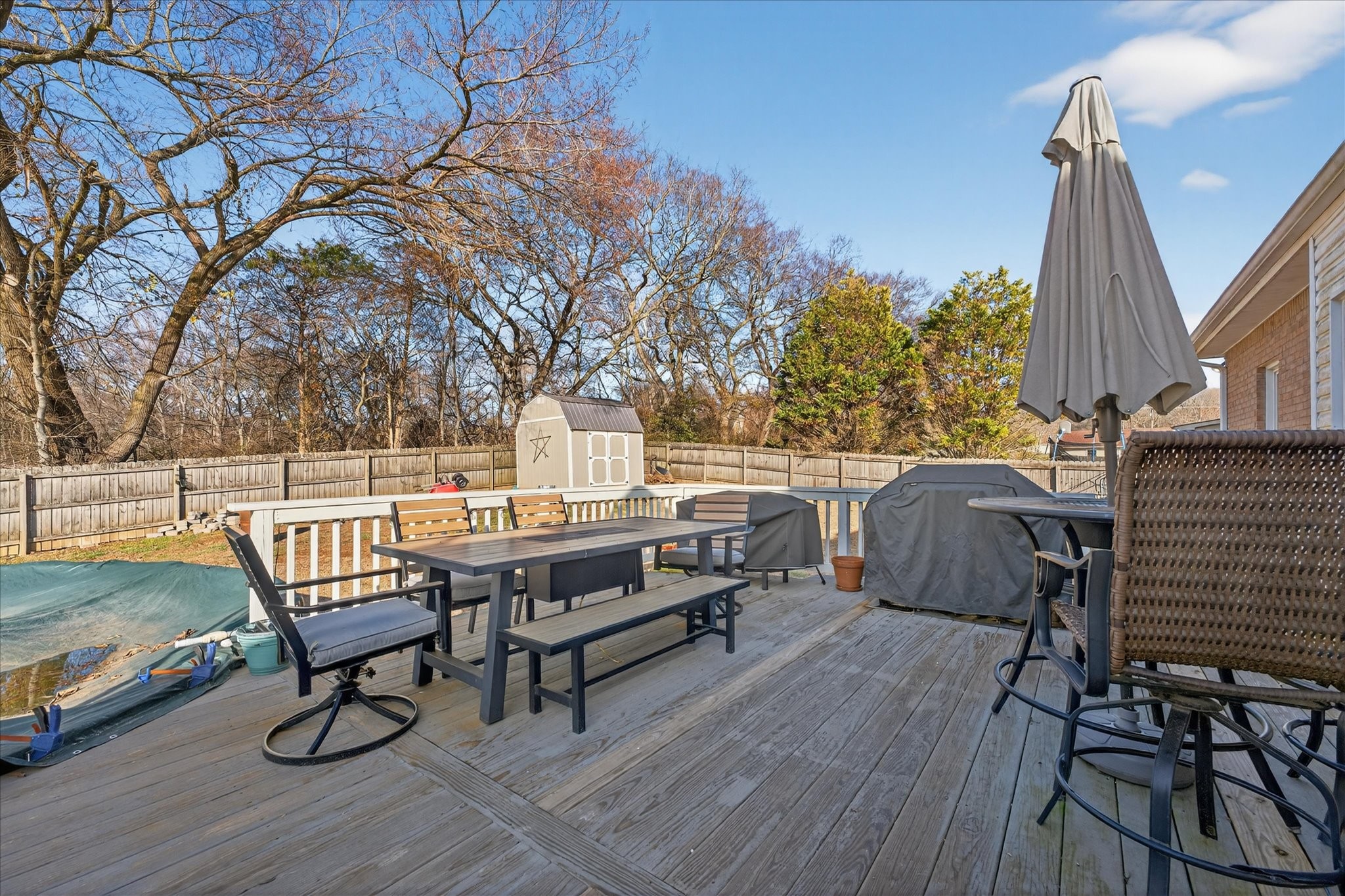 200 Cheshire Road Clarksville, TN 37043 - Photo 27 of 33 a view of a roof deck with table and chairs with wooden floor and fence