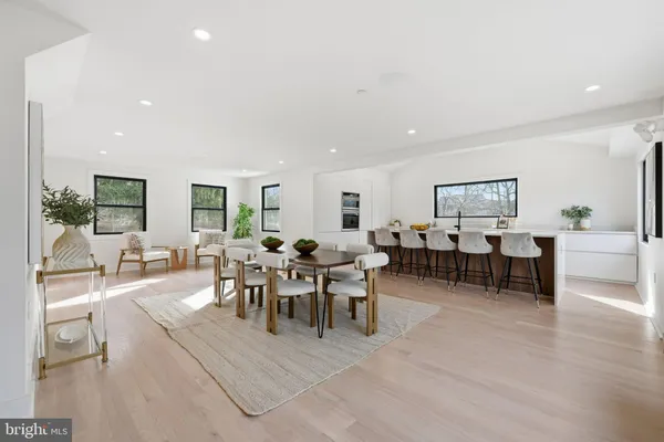 a view of a dining area with furniture and chandelier