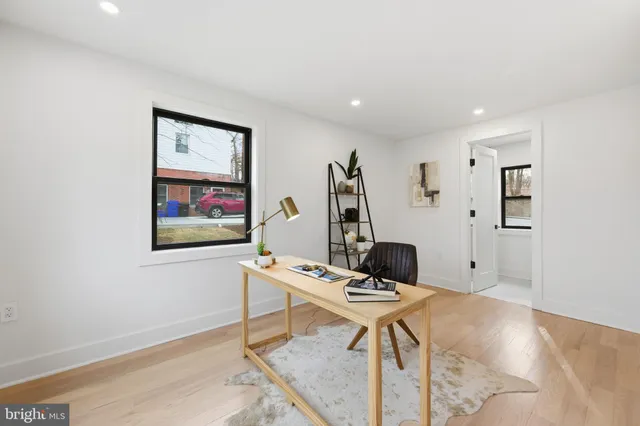 a workspace with furniture and white walls