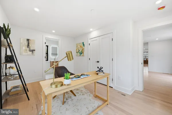 a workspace with furniture and wooden floor