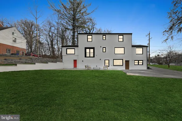 a view of a front of a house with a yard