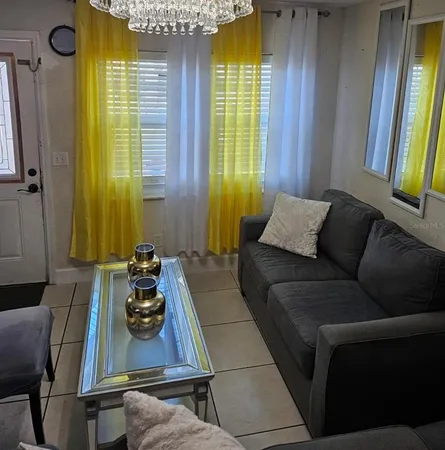 a living room with furniture and a window