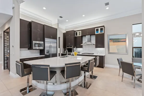 a kitchen with stainless steel appliances granite countertop a sink and stove