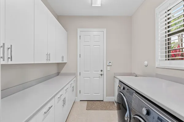 a view of staircase with wooden floor and a rug