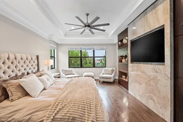 a living room with a flat screen tv with a fireplace