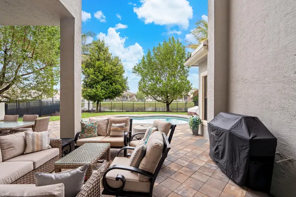 a view of a swimming pool with a patio