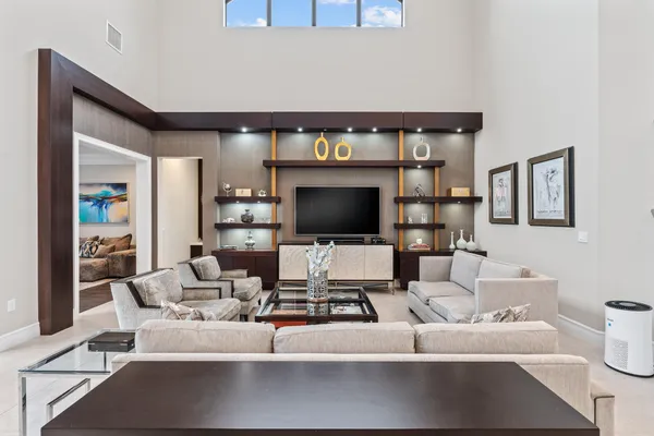 a living room with furniture and a flat screen tv