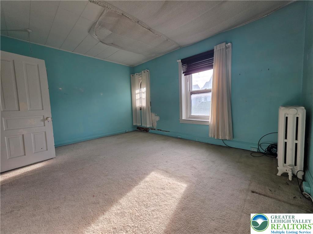 911 High Street Bethlehem, PA 18018 - Photo 12 of 15 A well-lit bedroom offering generous space and natural light, ready for personalization.
