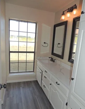 a white toilet sitting next to a shower
