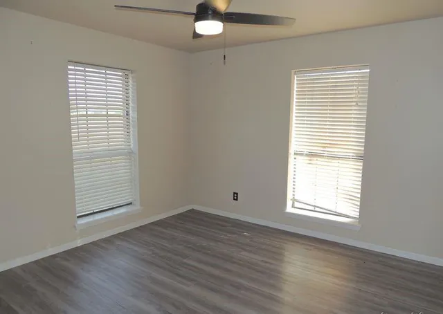 a view of staircase with white walls